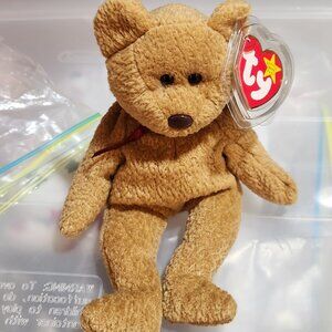 Curly the Bear Ty Beanie baby in mint condition, tag in tag protector